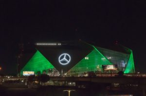 Mercedes-Benz Stadium lit in green in honor of our anniversary