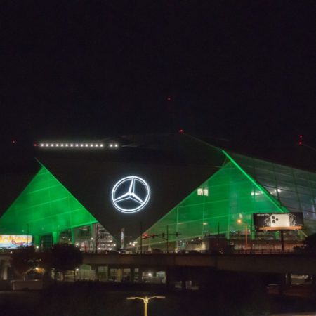 Mercedes-Benz Stadium lit in green in honor of our anniversary
